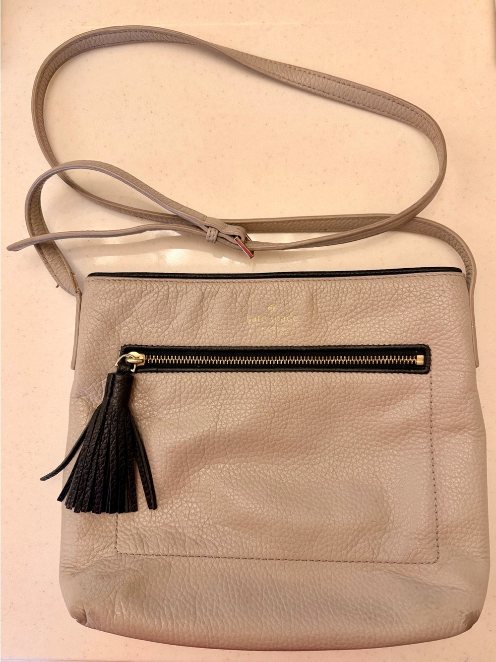 kate spade Taupe Leather Crossbody with Black Tassel and Gold Trim